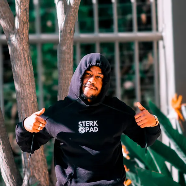 SterkOpad artist holding open a branded hoodie