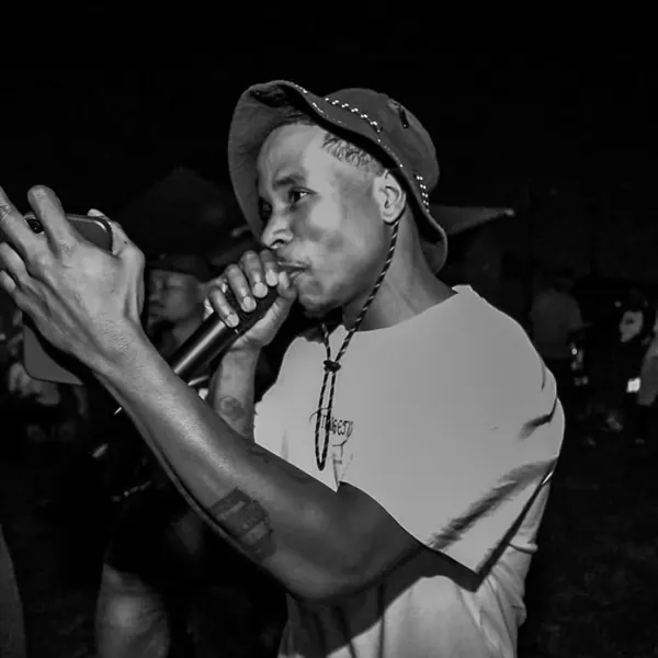 Black and white shot of an artist mid-verse
