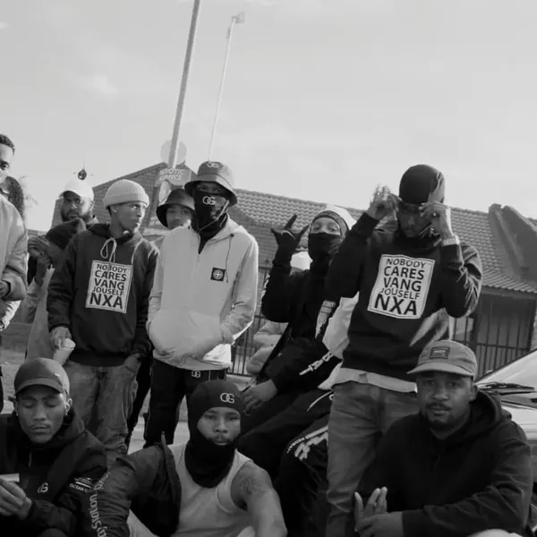 Black and white group shot of the crew outside