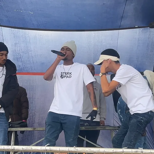 SterkOpad artists performing under a stage canopy