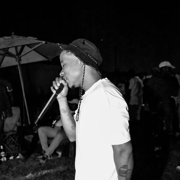 Black and white shot of an artist performing outdoors