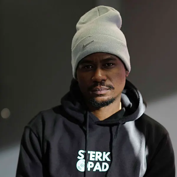 Portrait of a SterkOpad artist in a branded hoodie and beanie