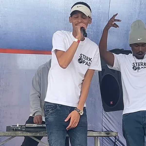 Two SterkOpad artists on stage at an outdoor show