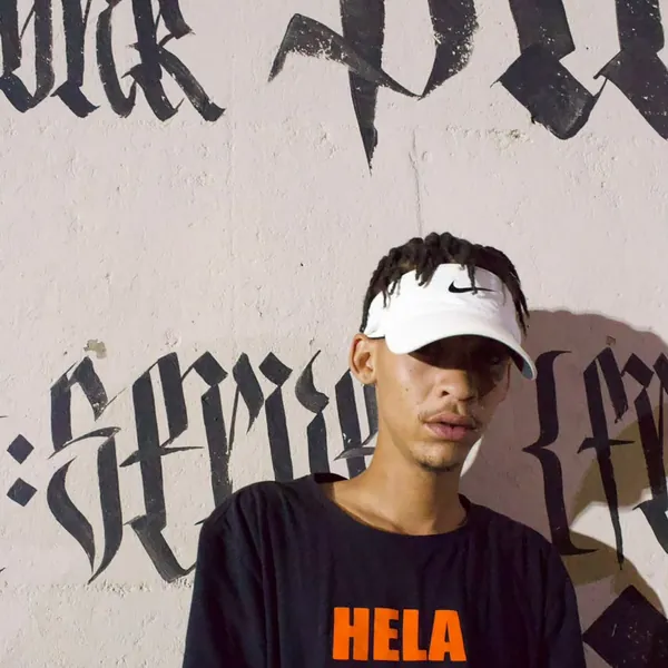 Larnie OGee in a HELA HELA tee and Nike visor