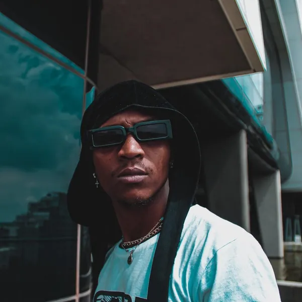 Xanny Pxxl in a hood and sunglasses